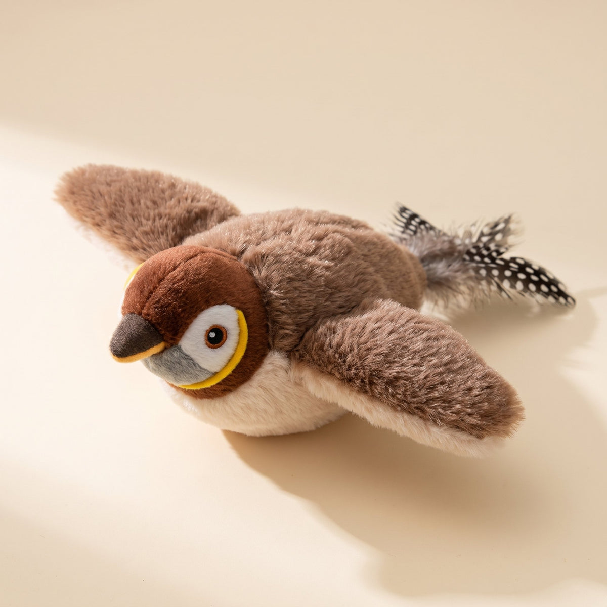 Plush sparrow cat toy with brown wings, cream belly and a speckled feather tail